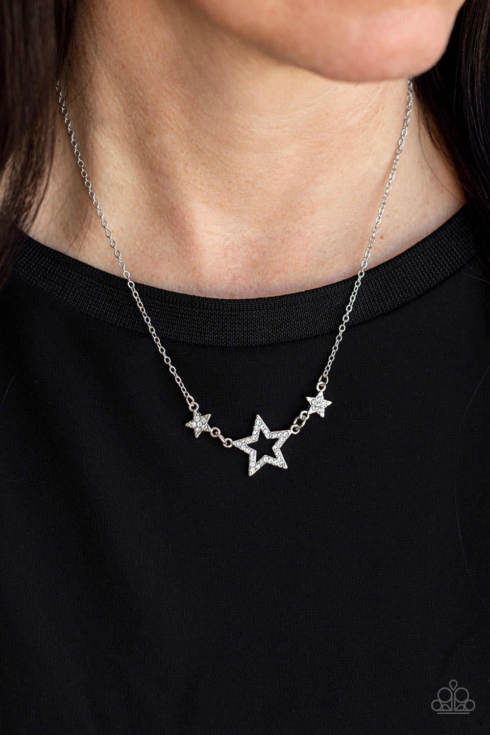 United We Sparkle White Necklace - Paparazzi Accessories  A white rhinestone encrusted silver star is flanked by two dainty white rhinestone encrusted silver stars, creating a sparkly patriotic pendant below the collar. Features an adjustable clasp closure.  Sold as one individual necklace. Includes one pair of matching earrings.
