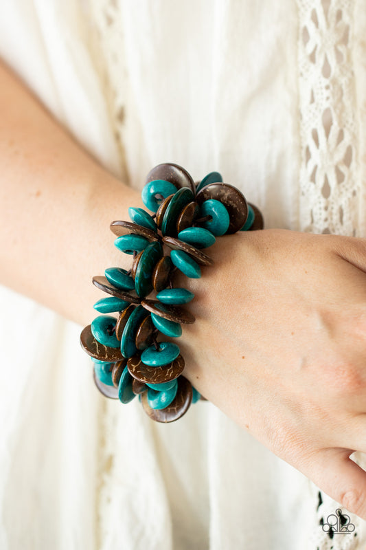 Caribbean Canopy Blue Bracelet - Paparazzi Accessories  A collection of turquoise and brown disc-shaped wooden beads are threaded along stretchy bands creating a tropical island vibe around the wrist.  Sold as one individual bracelet.