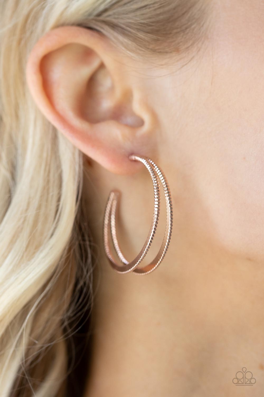 Rustic Curves Rose Gold Hoop Earring - Paparazzi Accessories  Featuring textured edges, two rose gold crescent frames delicately curve into a bold double hoop for an edgy urban look. Earring attaches to a standard post fitting. Hoop measures approximately 1 1/2" in diameter.  All Paparazzi Accessories are lead free and nickel free!   Sold as one pair of hoop earrings.