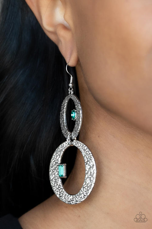 OVAL and OVAL Again Green Earring - Paparazzi Accessories  Infused with edgy marquise and emerald cut green rhinestones, hammered flat silver ovals delicately link into a gritty glamorous lure. Earring attaches to a standard fishhook fitting.  All Paparazzi Accessories are lead free and nickel free!  Sold as one pair of earrings.