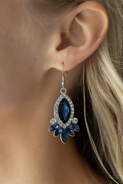 Prismatic Parade Blue Earring - Paparazzi Accessories  Bordered in glassy white rhinestones, an oversized blue gem gives way to a dazzling blue fringe of marquise cut rhinestones for a fabulous finish. Earring attaches to a standard fishhook fitting.  All Paparazzi Accessories are lead free and nickel free!  Sold as one pair of earrings.