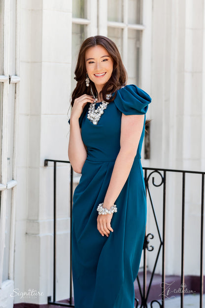 An elegantly effervescent collection of oversized pearls, glassy crystal-like beads, and white rhinestone studded silver ornaments effortlessly clusters along two bold silver chains below the collar. The bubbly bunched accents glamorously gather into a brilliantly boisterous fringe for an uproarious uptown fashion. Features an adjustable clasp closure.  All Paparazzi Accessories are lead free and nickel free!