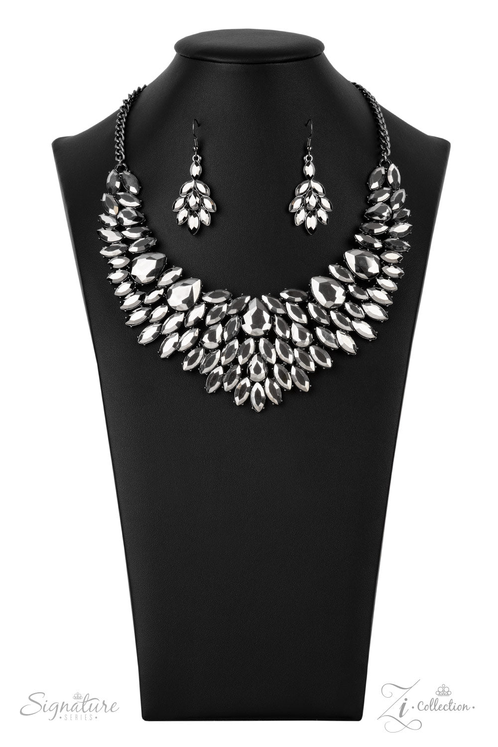 A smoldering collection of oversized teardrop and marquise cut hematite rhinestones daringly fan out from the collar, coalescing into intense interconnected frames. The dauntless display of dazzle locks in place, creating a stunningly solitaire sparkle. Features an adjustable clasp closure.  All Paparazzi Accessories are lead free and nickel free!