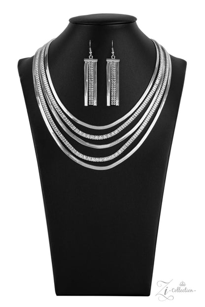 Persuasive 2021 Zi Collection Necklace - Paparazzi Accessories  Alternating rows of flat silver snake chain and glassy strands of edgy emerald cut rhinestones sleekly layer below the collar. The deceptively simple metallic silver and white rhinestone palette is unapologetically mesmerizing, making this smooth statement piece an instant classic. Features an adjustable clasp closure.  Sold as one individual necklace. Includes one pair of matching earrings.
