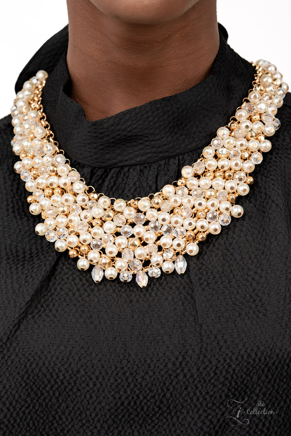Sentimental 2021 Zi Collection Necklace - Paparazzi Accessories  Mesmerizingly mismatched crystal-like beads, white pearls, and classic white rhinestones delicately attach to a golden chain net below the collar. Jampacked with noise-making shimmer, the effervescently clustered fringe dances with each movement for an elegantly bubbly finish. Features an adjustable clasp closure.  Sold as one individual necklace. Includes one pair of matching earrings.