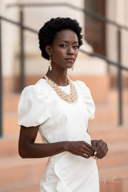 Sentimental 2021 Zi Collection Necklace - Paparazzi Accessories  Mesmerizingly mismatched crystal-like beads, white pearls, and classic white rhinestones delicately attach to a golden chain net below the collar. Jampacked with noise-making shimmer, the effervescently clustered fringe dances with each movement for an elegantly bubbly finish. Features an adjustable clasp closure.  Sold as one individual necklace. Includes one pair of matching earrings.