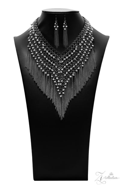 Impulsive 2021 Zi Collection Necklace - Paparazzi Accessories  Row after row of blinding white rhinestones trickle from a seemingly infinite collection of bold gunmetal links that interlock into an intensely tapered metallic net down the chest. Gritty gunmetal chains stream from the bottom of the glamorously grunge statement piece, adding hypnotic movement to the fearless attitude of this main attraction. Features an adjustable clasp closure. Includes one pair of matching earrings.