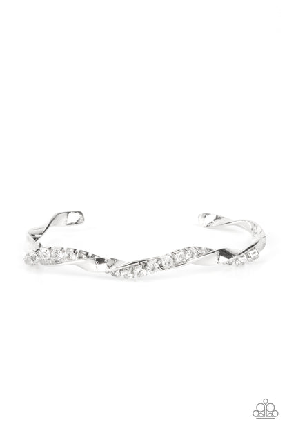 Twisted Twinkle White Cuff Bracelet - Paparazzi Accessories  A glittery strand of glassy white rhinestones twists with a shiny silver bar around the wrist, creating a dainty cuff.  Sold as one individual bracelet.