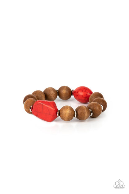 Abundantly Artisan Red Wood Bracelet - Paparazzi Accessories  Oversized brown wooden beads and mismatched red stone accents are separated by dainty silver discs and threaded along a stretchy band, creating an earthy centerpiece around the wrist.  Sold as one individual bracelet.
