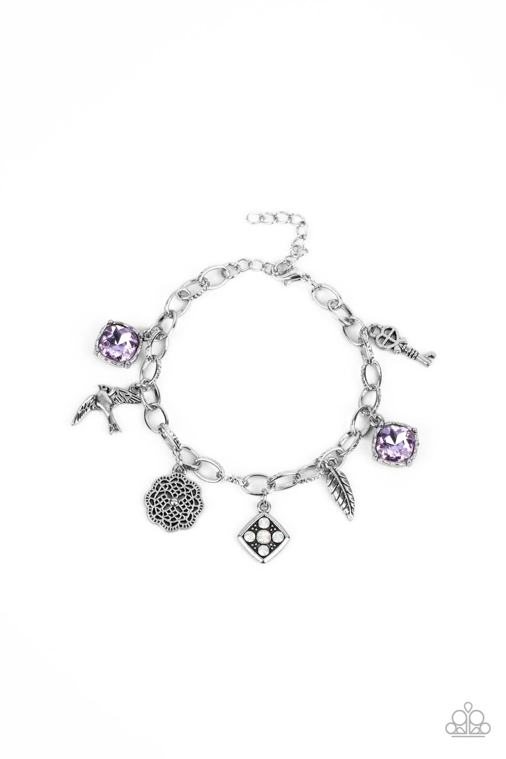 Fancifully Flighty Purple Charm Bracelet - Paparazzi Accessories  Sparkling purple gems, a floral medallion, a bird in flight, and a fluttering feather dangle from a delicate silver chain as they coalesce into a whimsical charm bracelet. Features an adjustable clasp closure.  All Paparazzi Accessories are lead free and nickel free!  Sold as one bracelet.