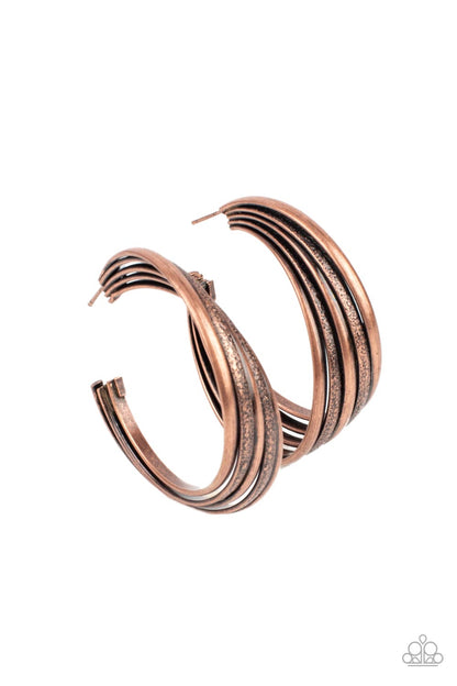 In Sync Copper Hoop Earring - Paparazzi Accessories  Antiqued textured copper rings alternate with shiny rings as they fuse together creating a curvy ribbon of rustic drama as they wrap around behind the ear. Earring attaches to a standard post fitting. Hoop measures approximately 2" in diameter.  Sold as one pair of hoop earrings.