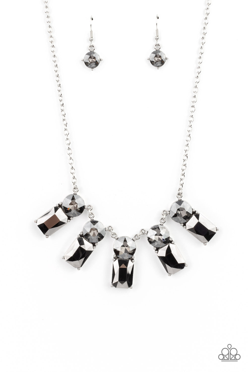 Celestial Royal Silver Necklace - Paparazzi Accessories  Featuring classic pronged fittings, a dramatic collection of oversized smoky rhinestones and emerald cut hematite gems fan out below the collar for an outrageous sparkle. Features an adjustable clasp closure.  All Paparazzi Accessories are lead free and nickel free!  Sold as one individual necklace. Includes one pair of matching earrings.