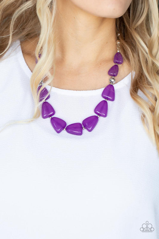 Tenaciously Tangy Purple Necklace - Paparazzi Accessories  Infused with dainty silver and faceted silver beads, imperfect triangular opaque purple beads are threaded along an invisible wire below the collar for a vivacious pop of color. Features an adjustable clasp closure.  Sold as one individual necklace. Includes one pair of matching earrings.