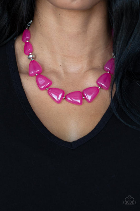 Tenaciously Tangy Pink Necklace - Paparazzi Accessories  Infused with dainty silver and faceted silver beads, imperfect triangular opaque Fuchsia Fedora beads are threaded along an invisible wire below the collar for a vivacious pop of color. Features an adjustable clasp closure.  Sold as one individual necklace. Includes one pair of matching earrings.