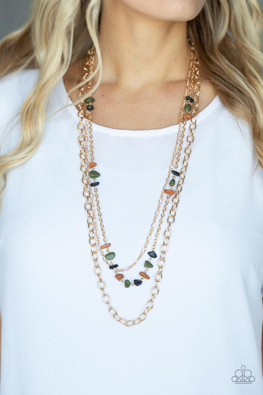 Artisanal Abundance Multi Necklace - Paparazzi Accessories  Infused with sections of earthy brown, black, and green stones, a trio of mismatched gold chains layer down the chest for a dash of rustic refinement. Features an adjustable clasp closure.  All Paparazzi Accessories are lead free and nickel free!   Sold as one individual necklace. Includes one pair of matching earrings.