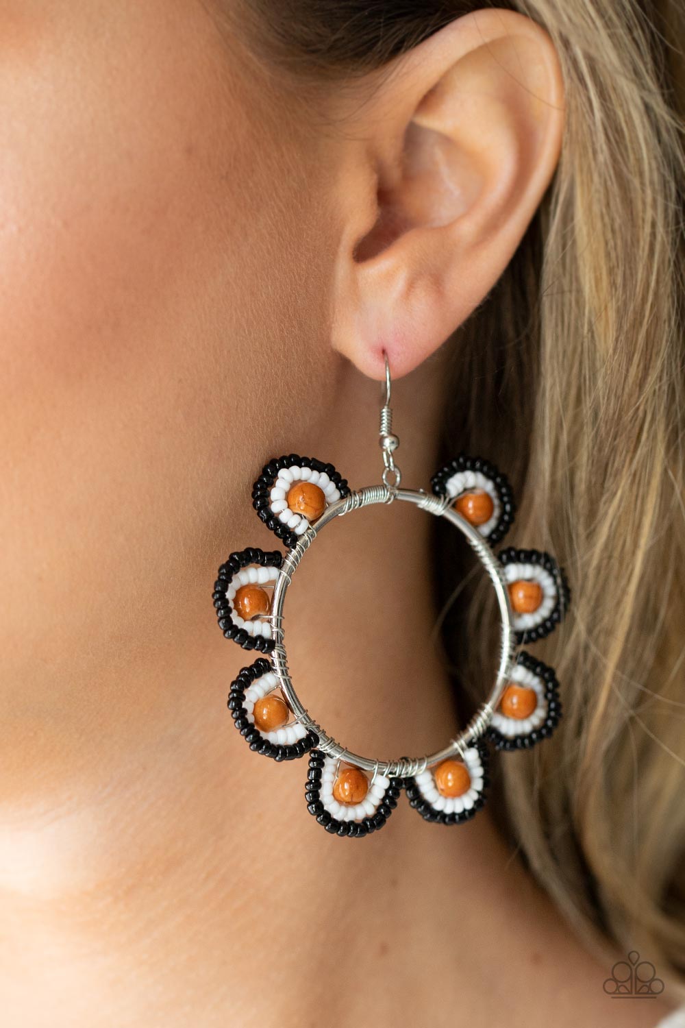Groovy Gardens Brown Seed Bead Earring - Paparazzi Accessories  Infused with earthy brown stone bead centers, rows of black and white seed beads are threaded along dainty wires along the outside of a shiny silver hoop for a vivacious floral look. Earring attaches to a standard fishhook fitting.  Sold as one pair of earrings.