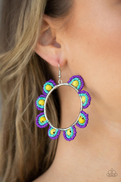 Groovy Gardens Yellow Earring - Paparazzi Accessories  Infused with sunny yellow stone bead centers, rows of purple and turquoise seed beads are threaded along dainty wires along the outside of a shiny silver hoop for a vivacious floral look. Earring attaches to a standard fishhook fitting.  Sold as one pair of earrings.