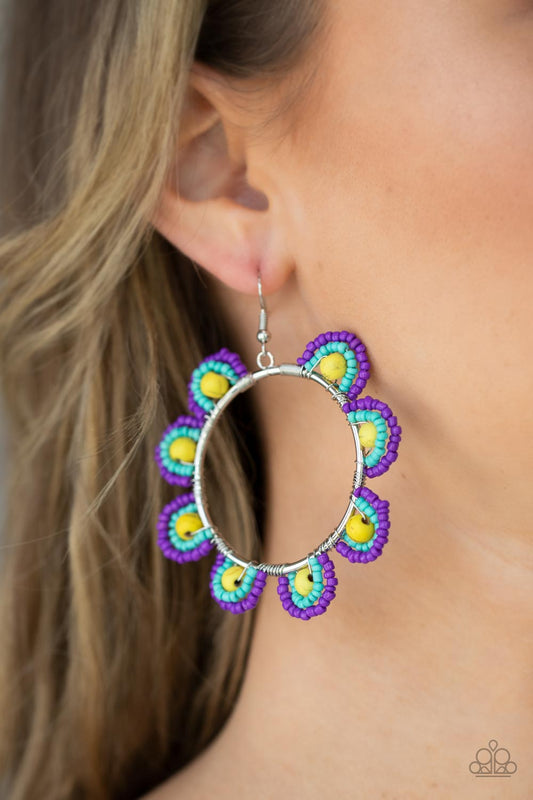Groovy Gardens Yellow Earring - Paparazzi Accessories  Infused with sunny yellow stone bead centers, rows of purple and turquoise seed beads are threaded along dainty wires along the outside of a shiny silver hoop for a vivacious floral look. Earring attaches to a standard fishhook fitting.  Sold as one pair of earrings.