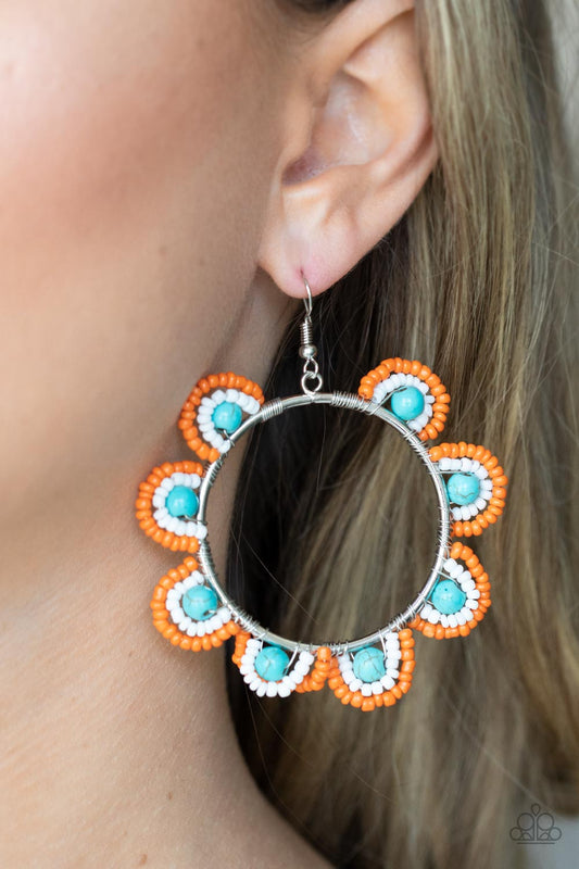 Groovy Gardens Blue Seed Bead Earring - Paparazzi Accessories  Infused with refreshing turquoise stone bead centers, rows of orange and white seed beads are threaded along dainty wires along the outside of a shiny silver hoop for a vivacious floral look. Earring attaches to a standard fishhook fitting.  Sold as one pair of earrings.