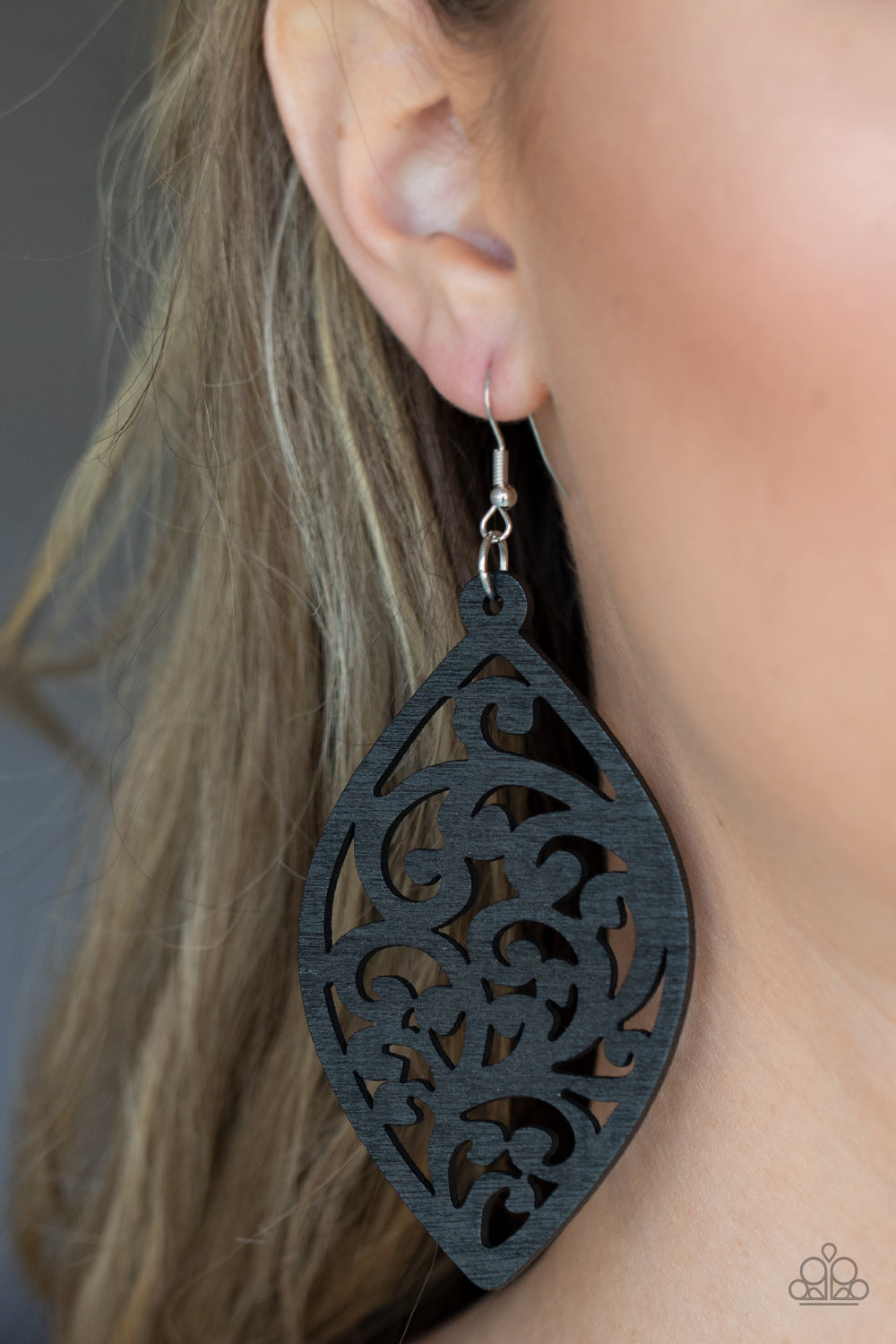Coral Garden Black Wooden Earring - Paparazzi Accessories  Painted in a shiny black finish, a floral motif permeates an airy oval wooden frame creating a tropical-inspired lure. Earring attaches to a standard fishhook fitting.  Sold as one pair of earrings.
