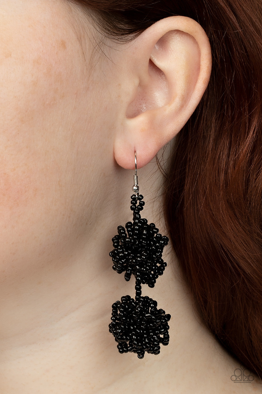 Celestial Collision Black Seed Bead Earring - Paparazzi Accessories  Strands of shiny black seed beads delicately knot into an elegantly clustered lure, creating a stellar modern look. Earring attaches to a standard fishhook fitting.  Sold as one pair of earrings.