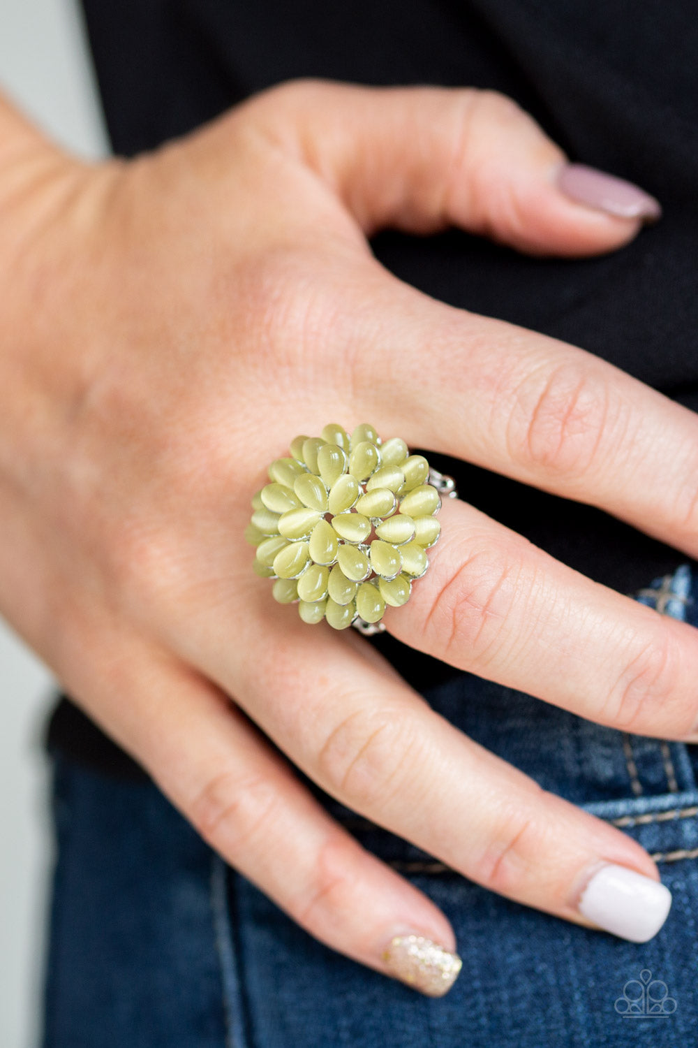 Bloomin Bloomer - Yellow Row after row of teardrop cat's eye stones stack into a blast of yellow petals atop the finger, creating a whimsical blossom. Features a stretchy band for a flexible fit.  Sold as one individual ring.