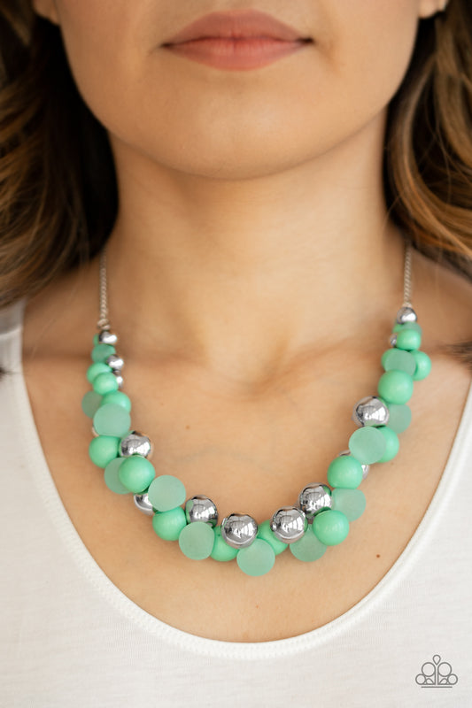 Bubbly Brilliance - Green Item #N766 A bubbly collection of imperfect silver, opaque, and Biscay Green beads are threaded along an invisible wire below the collar, creating a colorful cluster. Features an adjustable clasp closure. All Paparazzi Accessories are lead free and nickel free!  Sold as one individual necklace. Includes one pair of matching earrings.