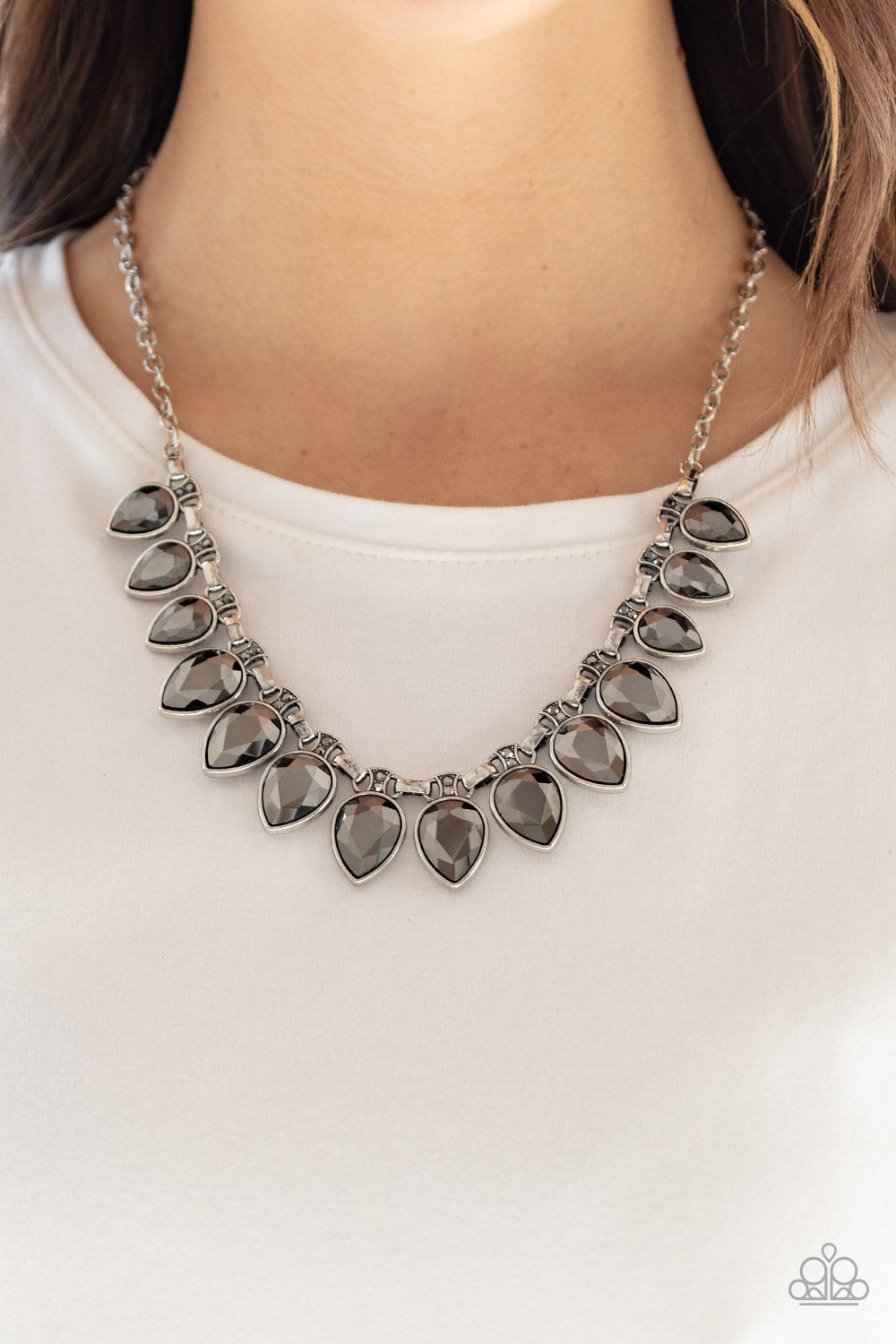 FEARLESS is More Silver Necklace - Paparazzi Accessories Item #N455 Dotted with dainty hematite rhinestones, a fierce fringe of oversized hematite teardrop frames fan out below the collar for a fearless fashion. Features an adjustable clasp closure. All Paparazzi Accessories are lead free and nickel free!  Sold as one individual necklace. Includes one pair of matching earrings.