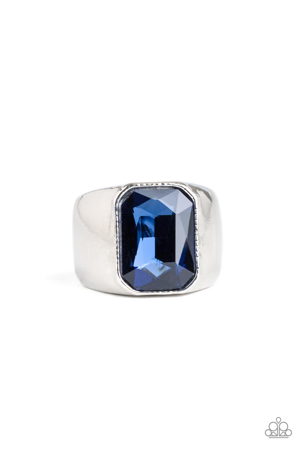 Scholar - Blue Featuring a kingly emerald style cut, an oversized blue rhinestone is pressed into the center of a glistening silver band for a statement look. Features a stretchy band for a flexible fit.  Sold as one individual ring.