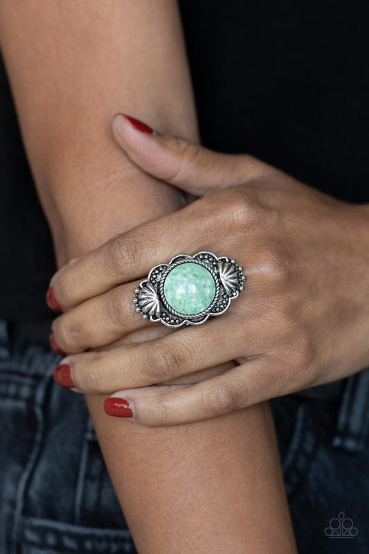 Atlantis Adventure - Green Item #P4SE-GRXX-121XX Adorned in silver seashells and dainty silver studs, the center of a scalloped silver frame is dotted with an oversized green stone for an artisan inspired finish. Features a stretchy band for a flexible fit.  Sold as one individual ring.