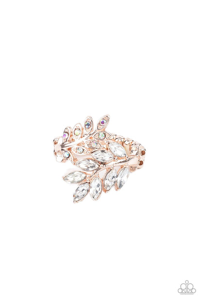 Glowing Gardenista Rose Gold Ring - Paparazzi Accessories  Encrusted in glassy white and iridescent rhinestones, two leafy rose gold bands delicately overlap across the finger for a sparkly seasonal look. Features a stretchy band for a flexible fit.  Featured inside The Preview at GLOW!  Sold as one individual ring.