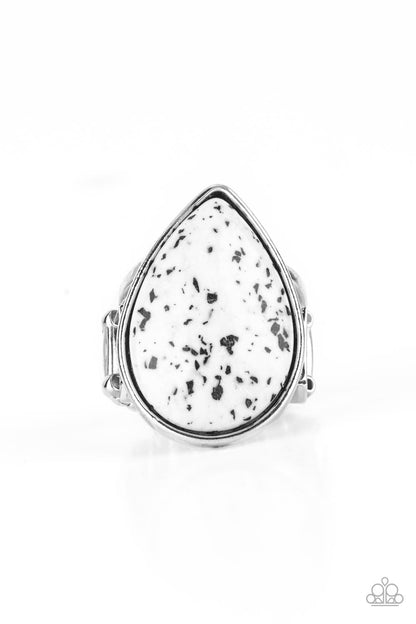 Stormy Sunrise White Ring - Paparazzi Accessories  A generous polished white stone infused with black flecks is encased in a simple silver teardrop frame resulting in a seasonal finish atop the finger. Features a stretchy band for a flexible fit.  Sold as one individual ring.