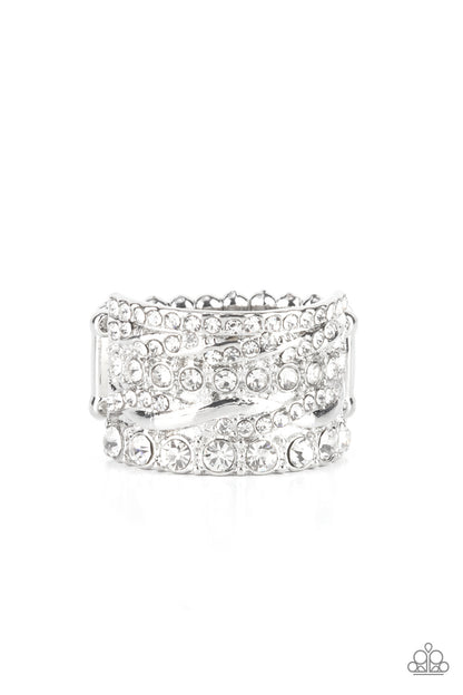 Exclusive Elegance White Ring - Paparazzi Accessories  Row after row of radiantly mismatched white rhinestones and glistening silver bands haphazardly stack across the finger, coalescing into a dramatic display of dazzle. Features a stretchy band for a flexible fit.  All Paparazzi Accessories are lead free and nickel free!  Sold as one individual ring.