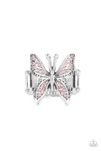Blinged Out Butterfly Pink Ring - Paparazzi Accessories  Glittery sections of pink rhinestones delicately encrust the decorative wings of a silver butterfly, creating a whimsically fluttering centerpiece atop the finger. Features a stretchy band for a flexible fit.  Sold as one individual ring.