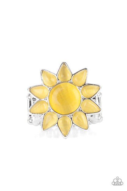 Blossoming Sunbeams Yellow Flower Ring - Paparazzi Accessories  Dainty teardrop yellow cat's eye stones bloom from a round yellow cat's eye stone center, creating a sunny blossom atop the finger. Features a stretchy band for a flexible fit.  Sold as one individual ring.