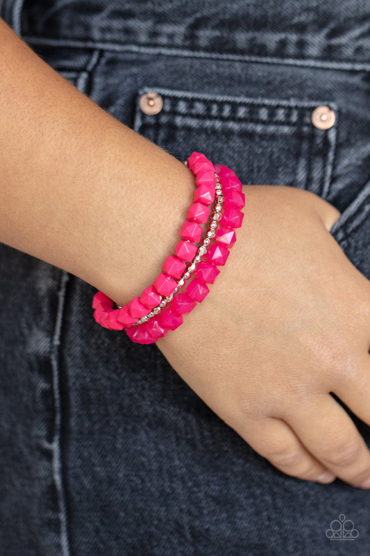 Vacay Vagabond Pink Bracelet - Paparazzi Accessories  Infused with a strand of round and faceted silver beads, faceted rows of solid and opaque pink cube beads are threaded along stretchy bands, wrapping around the wrist for a vivacious pop of color.  All Paparazzi Accessories are lead free and nickel free!  Sold as one set of three bracelets.