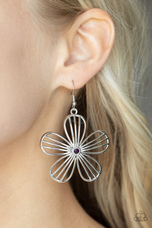 Meadow Musical Purple Earring - Paparazzi Accessories  Dotted with a dainty purple rhinestone, airy silver petals streaked with linear bars bloom into an enchanting floral frame. Earring attaches to a standard fishhook fitting.  Sold as one pair of earrings.