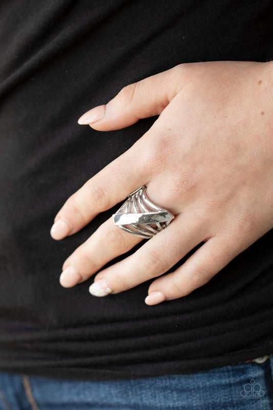 Encrypted Edge Silver Ring - Paparazzi Accessories  A daring hammered silver column slants across the finger intersecting an airy layered band resulting in a dramatically edgy vibe. Features a stretchy band for a flexible fit.  Sold as one individual ring.
