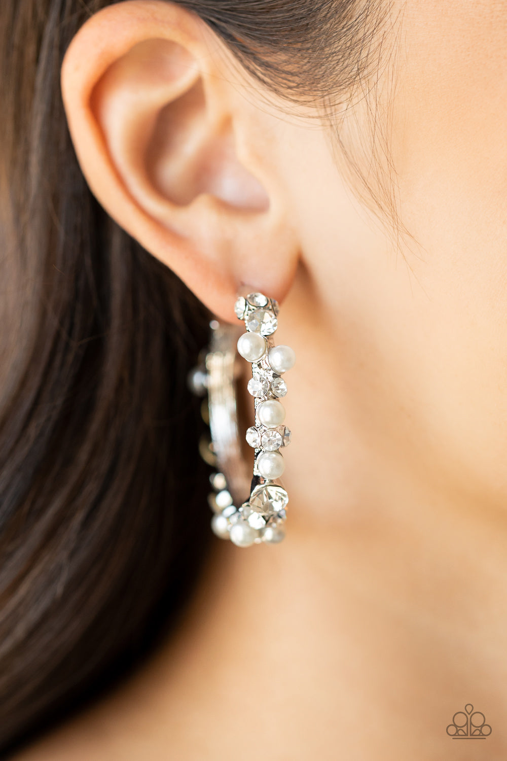 Let There Be SOCIALITE White Hoop Earring - Paparazzi Accessories  A bubbly array of classic white rhinestones and glassy white rhinestones are encrusted along the front of a silver hoop, creating an elegantly effervescent look. Earring attaches to a standard post fitting. Hoop measures approximately 1 1/2" in diameter.  All Paparazzi Accessories are lead free and nickel free!  Sold as one pair of hoop earrings.