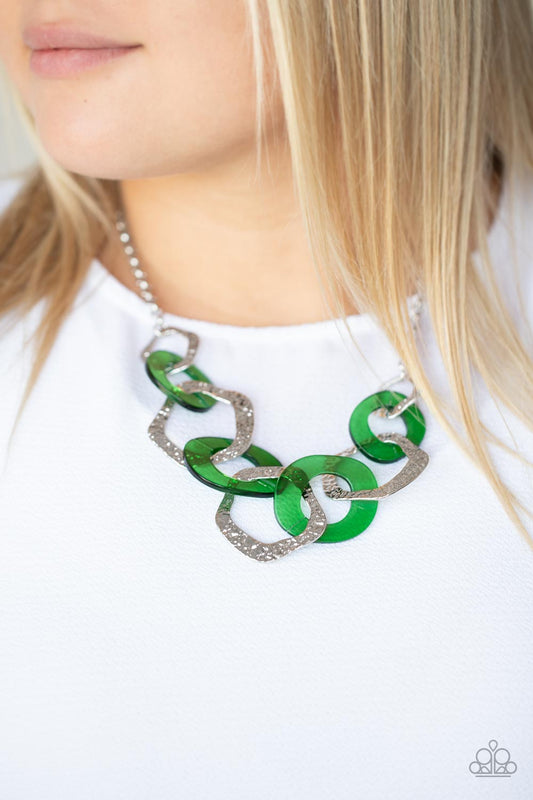 Urban Circus Green Necklace - Paparazzi Accessories  An asymmetrical assortment of Leprechaun acrylic rings and hammered silver hoops boldly interlock below the collar, creating an intense pop of color. Features an adjustable clasp closure.  All Paparazzi Accessories are lead free and nickel free!  Sold as one individual necklace. Includes one pair of matching earrings.