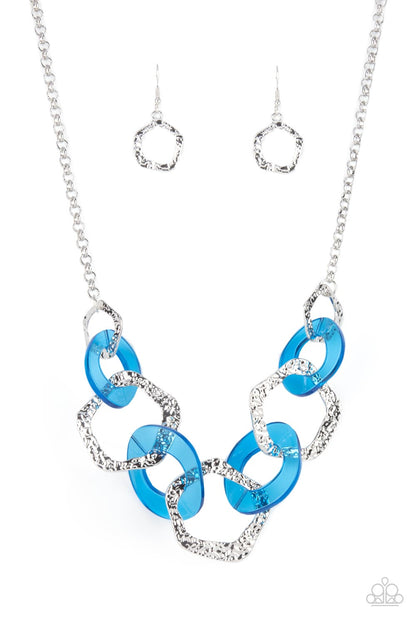 Urban Circus Blue Necklace - Paparazzi Accessories  An asymmetrical assortment of neon blue acrylic rings and hammered silver hoops boldly interlock below the collar, creating an intense pop of color. Features an adjustable clasp closure.  All Paparazzi Accessories are lead free and nickel free!   Sold as one individual necklace. Includes one pair of matching earrings.