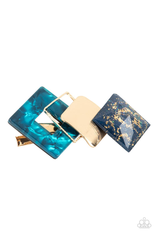 Geometrically Gatsby Blue Hair Clip - Paparazzi Accessories  Infused with gold sparkles, a faceted blue acrylic frame delicately overlaps with a golden square and a blue shell-like frame across the front of a classic gold bar for a deco inspired finish. Features a standard hair clip on the back.  Featured inside The Preview at GLOW! Sold as one individual hair clip.