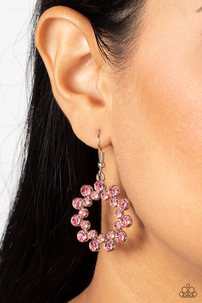 Champagne Bubbles Pink Earring - Paparazzi Accessories  A ring of classic Pale Rosette rhinestones flare out from a dainty ring of Pale Rosette rhinestones, coalescing into a bubbly and sparkly hoop. Earring attaches to a standard fishhook fitting.  Sold as one pair of earrings.