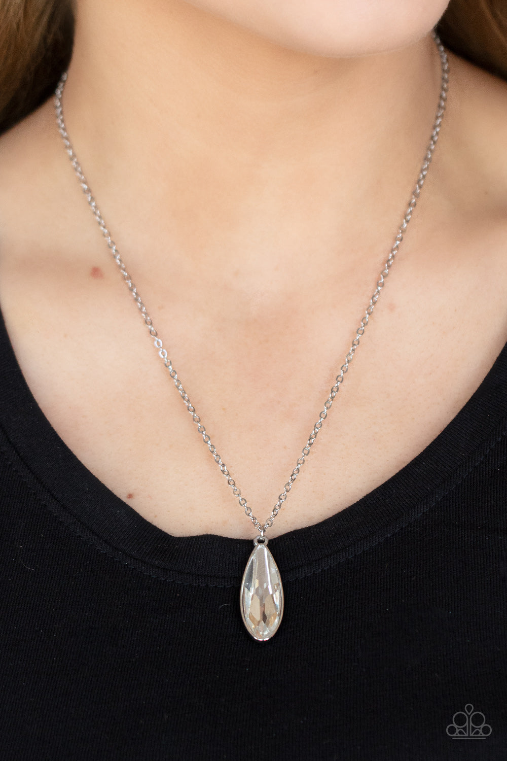Prismatically Polished White Necklace - Paparazzi Accessories  Encased in a sleek silver fitting, an elongated white teardrop gem swings from the bottom of a classic silver chain below the collar for a timeless elegance. Features an adjustable clasp closure.  Sold as one individual necklace. Includes one pair of matching earrings.
