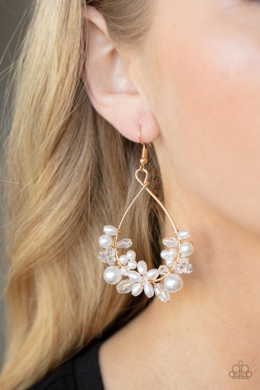 Marina Banquet Gold Earring - Paparazzi Accessories Item #P5RE-GDXX-234XX A bubbly collection of white pearls and white crystal-like beads are threaded along the bottom of a dainty gold wire hoop, creating twinkly floral accents. Earring attaches to a standard fishhook fitting.  Sold as one pair of earrings.
