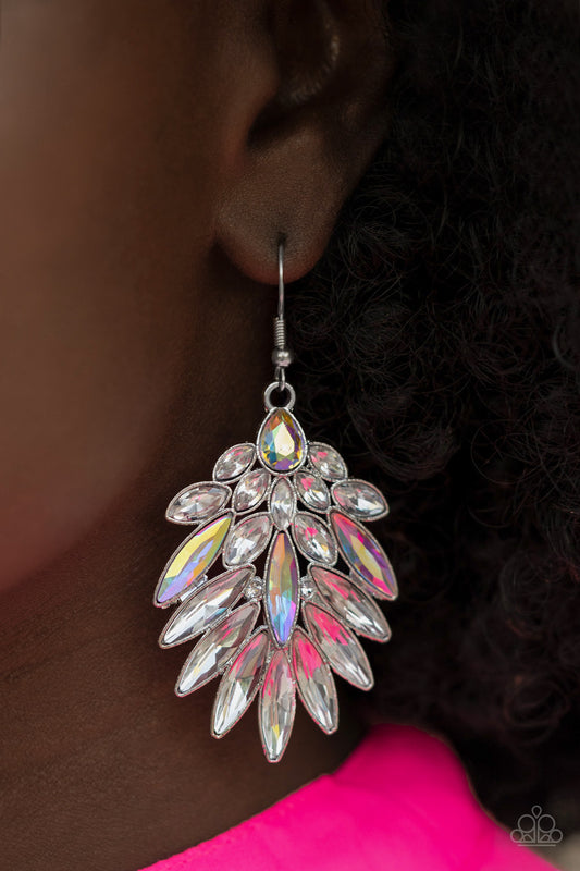 COSMIC-politan Multi Iridescent Earring - Paparazzi Accessories    An iridescent teardrop rhinestone gives way to a sparkly fan of classic white and oblong iridescent marquise cut rhinestones, coalescing into an out-of-this-world statement piece. Earring attaches to a standard fishhook fitting.  Sold as one pair of earrings.