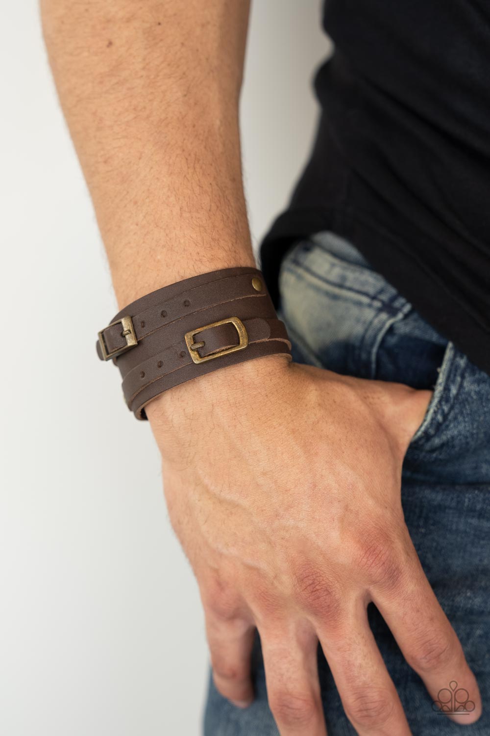 Bronco Bustin Buckles Brass Wrap Bracelet - Paparazzi Accessories   A pair of brown leather brass buckles are buckled in place across the front of a rustic brown leather band for a seasonal look. Features an adjustable snap closure.  Sold as one individual bracelet.