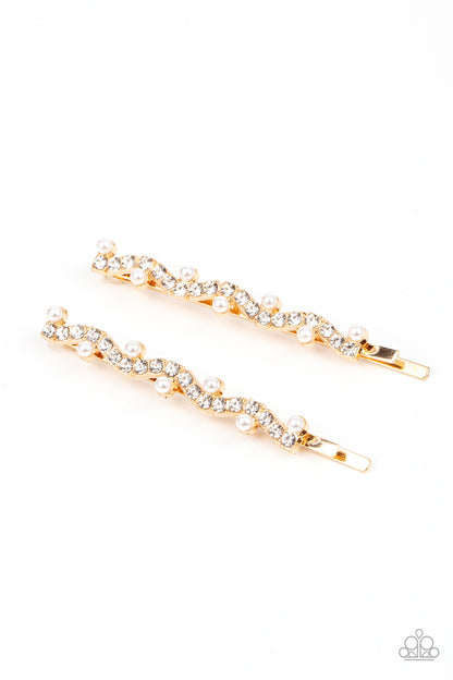Ballroom Banquet Gold Hair Clip - Paparazzi Accessories  A wavy row of glittery white rhinestones is flanked between dainty white pearls along the front of a gold bobby pin for a refined fashion.  Sold as one pair of decorative bobby pins.