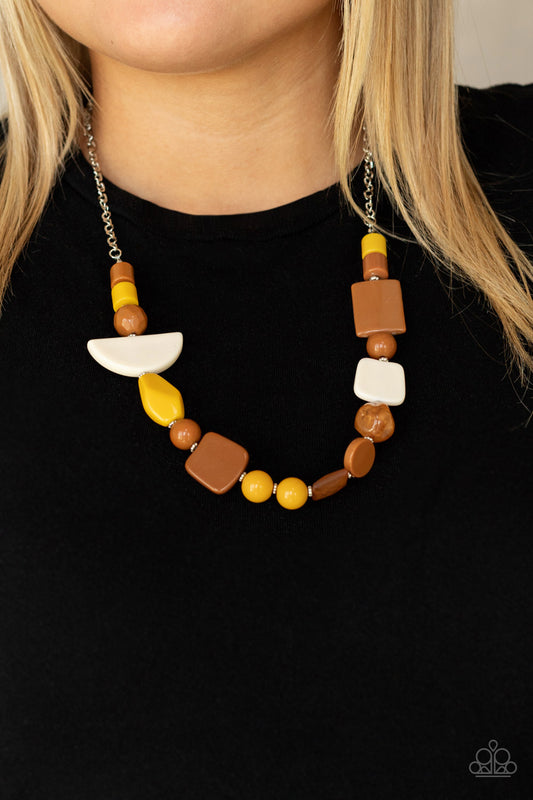 Tranquil Trendsetter Yellow Necklace - Paparazzi Accessories  Featuring the rustic hues of Adobe, Mustard, and Soybean, mismatched acrylic and faux rock beads are haphazardly threaded along an invisible wire below the collar for an abstract artisan vibe. Features an adjustable clasp closure.  All Paparazzi Accessories are lead free and nickel free!  Sold as one individual necklace. Includes one pair of matching earrings.