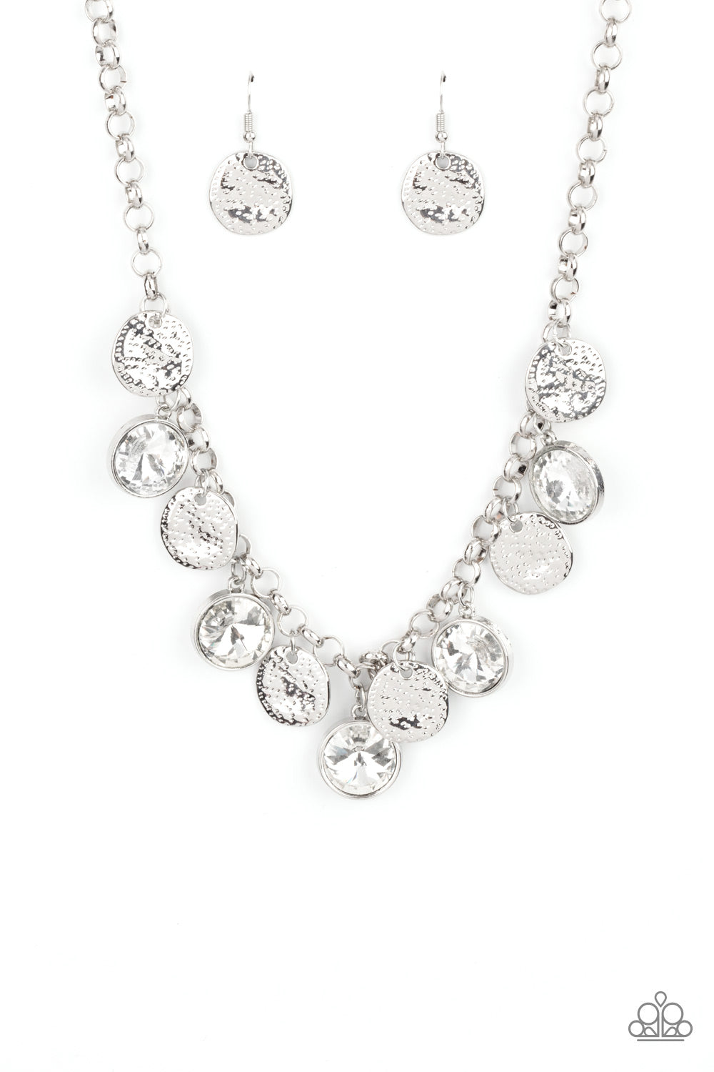 Spot On Sparkle White Necklace - Paparazzi Accessories  A blinding collection of hammered silver discs and oversized white gems swing from the bottom of a bold silver chain, creating noise-making sparkle below the collar. Features an adjustable clasp closure.  All Paparazzi Accessories are lead free and nickel free!  Sold as one individual necklace. Includes one pair of matching earrings.